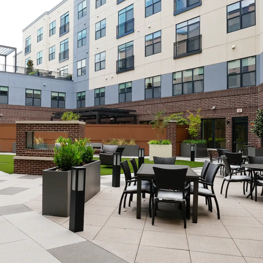 a man and woman smiling and holding a cup of coffee