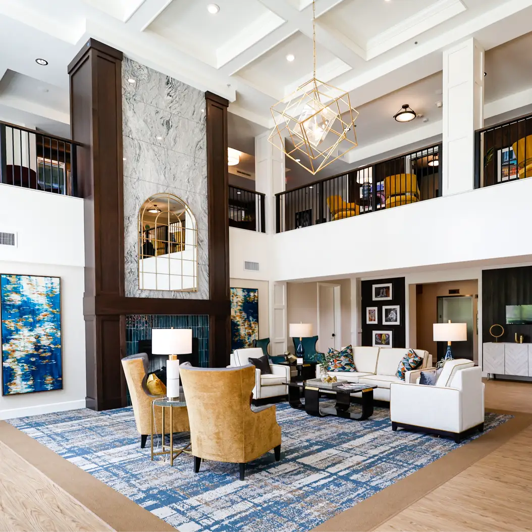 a man and woman smiling and holding a cup of coffee